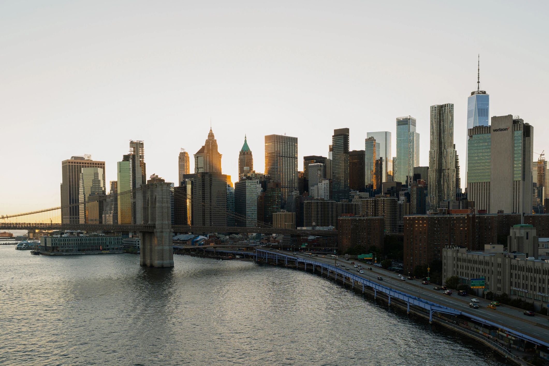 New York City skyline with Brooklyn Bridge at sunset